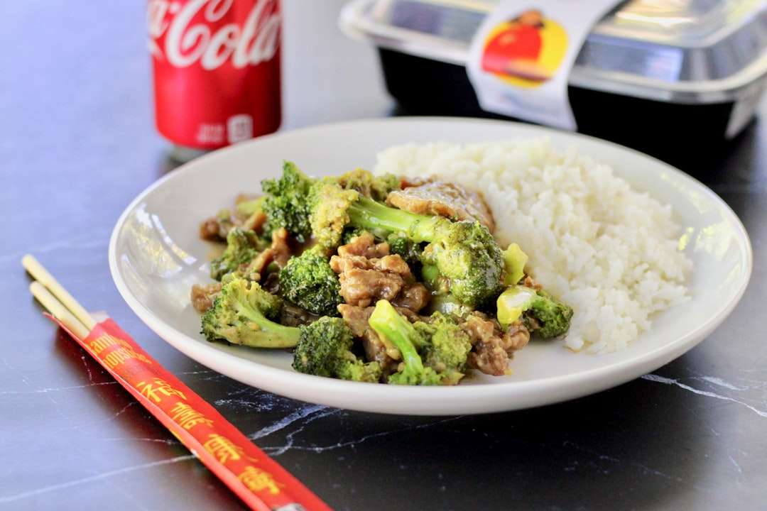 beef-broccoli-stir-fry-2 Beef and broccoli stir fry with white rice next to a can of Coca-Cola