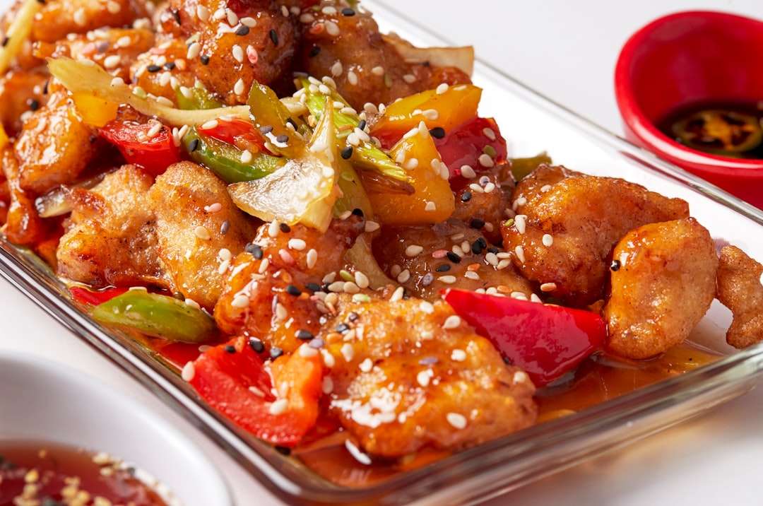 sweet-and-sour-chicken Crispy sweet and sour chicken pieces tossed with bell peppers and pineapple chunks