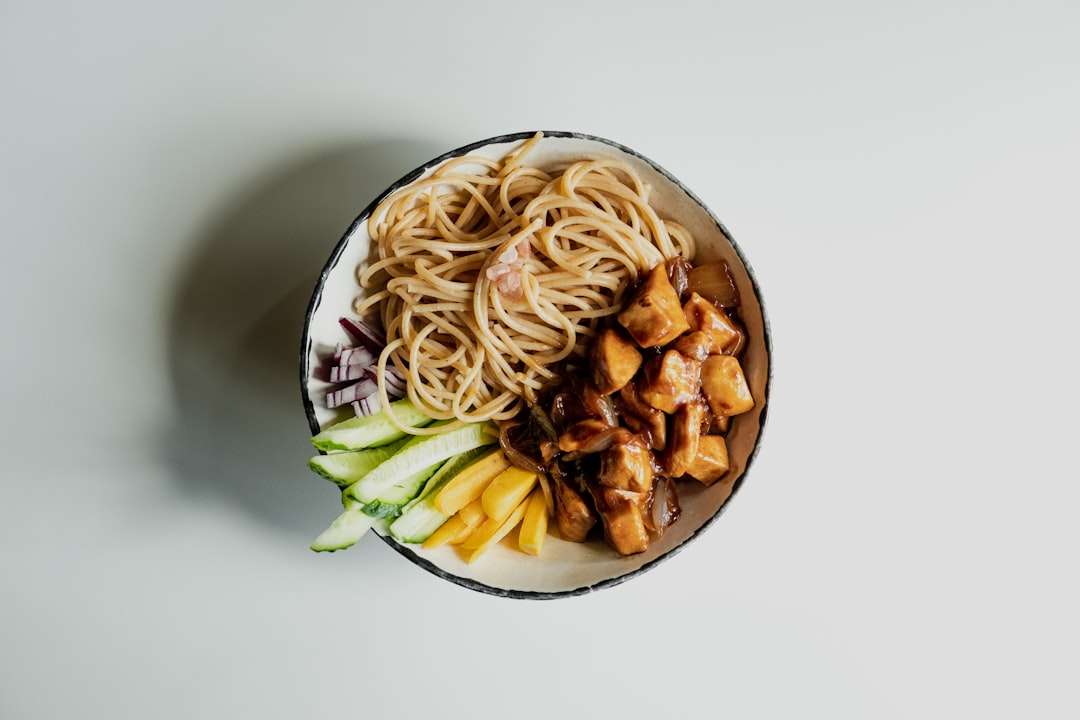 Healthy teriyaki tempeh bowl with brown rice, broccoli, and sesame seeds