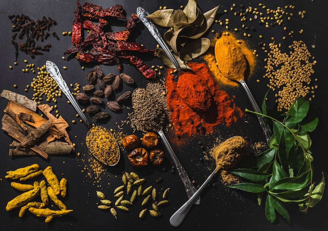the-complete-guide-to-fresh-vs-dried-spices Vibrant selection of powdered spices and dried chili peppers for cooking