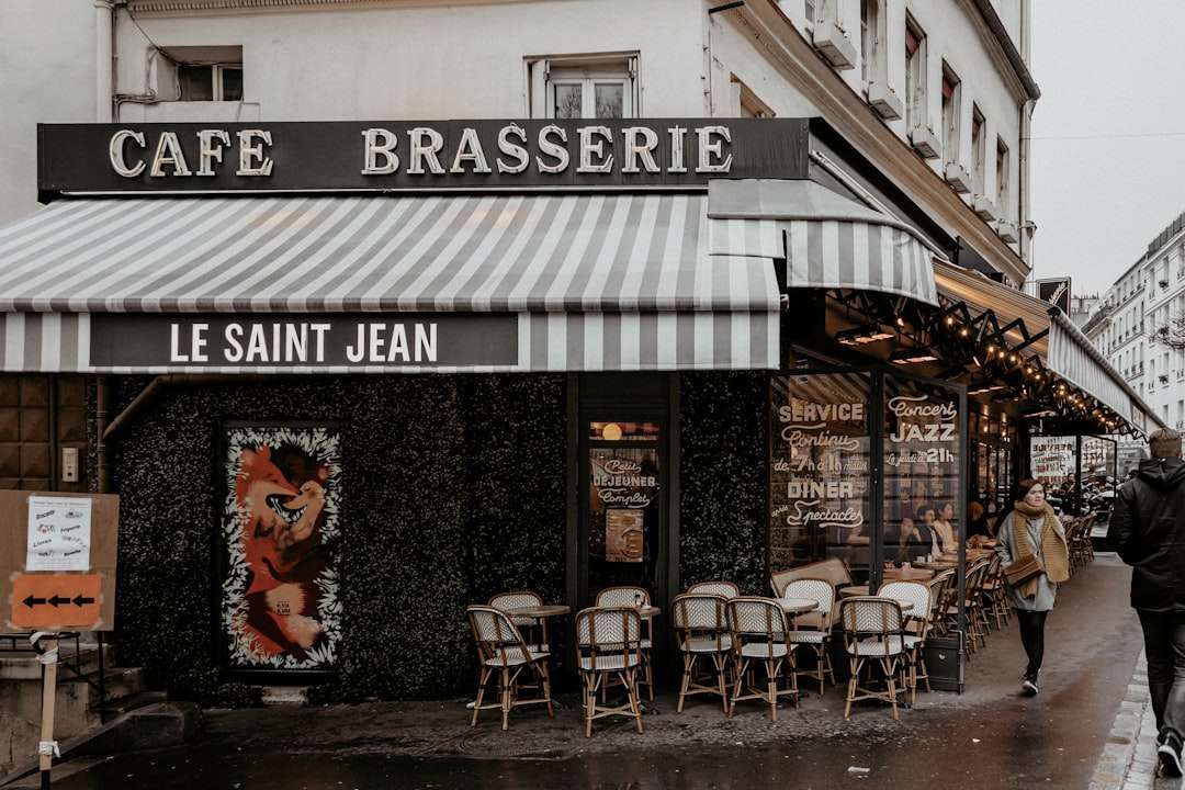 Vintage exterior facade of a traditional Parisian brasserie restaurant