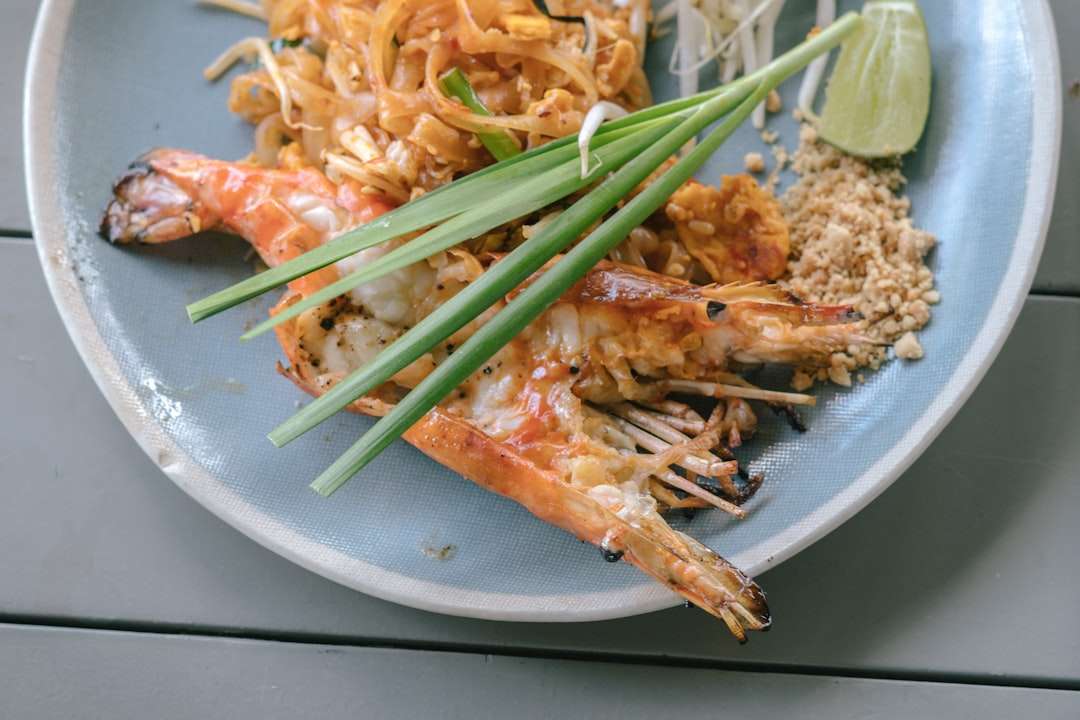 Authentic Pad Thai noodles served with large grilled prawns, bean sprouts, and chives Authentic Pad Thai noodles served with large grilled prawns, bean sprouts, and chives