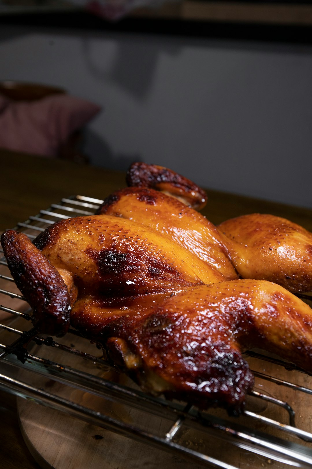 A perfectly golden brown, crispy whole roasted chicken cooked in an air fryer