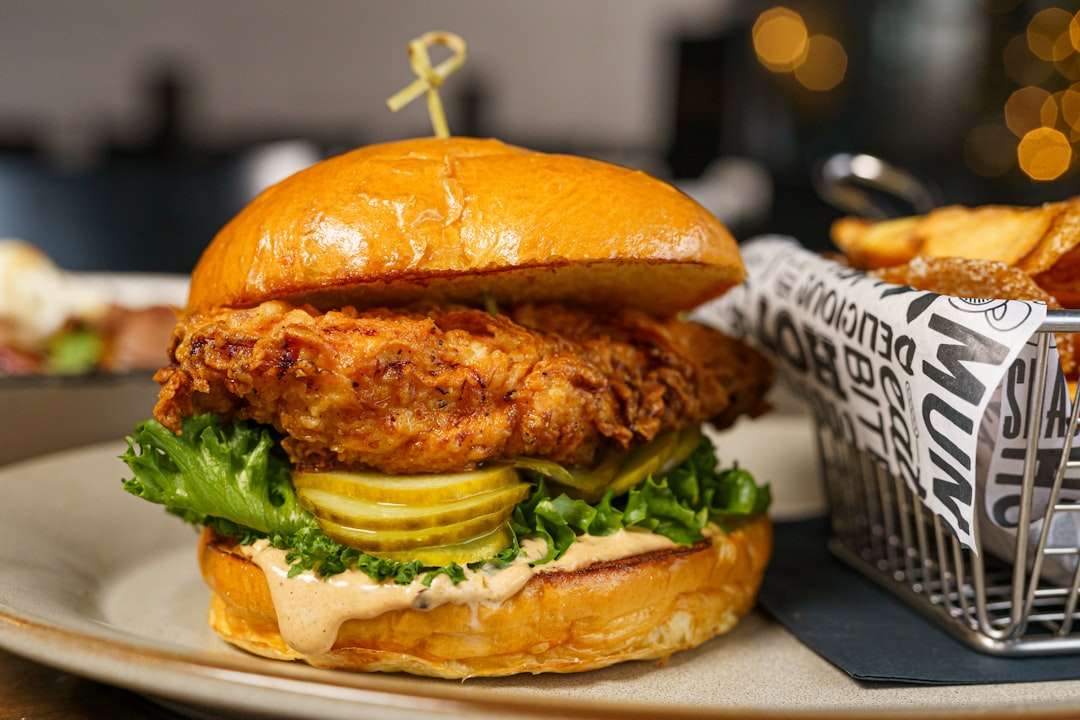 crispy-chicken-burger Ultra crispy fried chicken burger with homemade sauce inside a toasted brioche bun