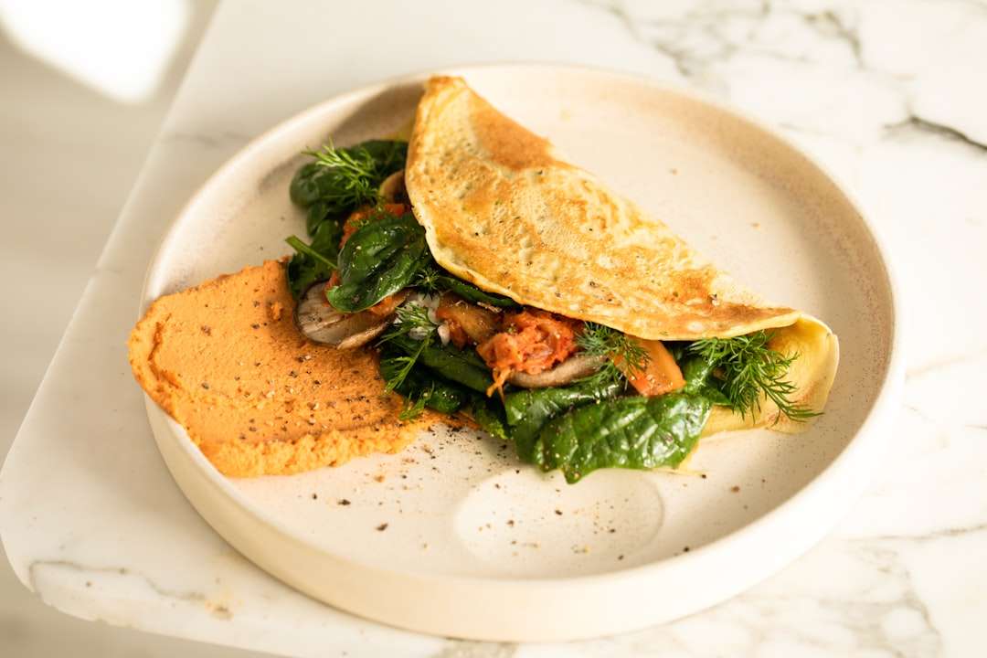 Healthy high-protein meal featuring sliced smoked turkey breast and sautéed spinach