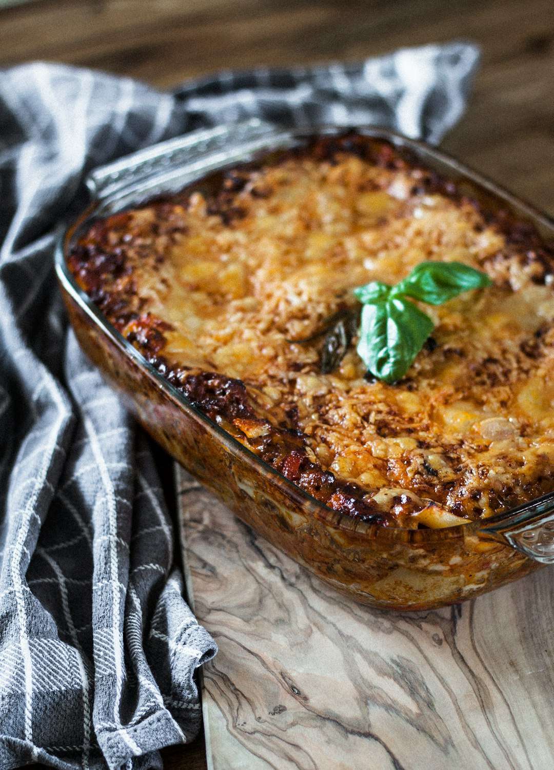 vegetarian-eggplant-moussaka A baked casserole dish of hot vegetarian eggplant moussaka topped with bubbly melted cheese